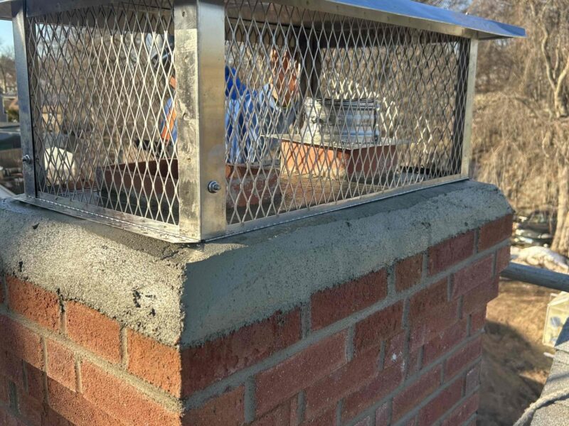New Britain Finished Chimney Rebuild and Cap Completed brick chimney rebuild with custom stainless-steel cap in New Britain, CT