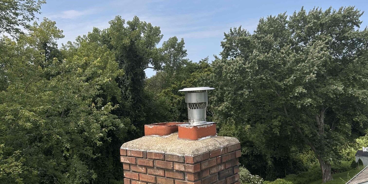 Finished chimney and cap – Bethel, CT Finished brick chimney with a stainless cap after a liner installation in Bethel, CT.