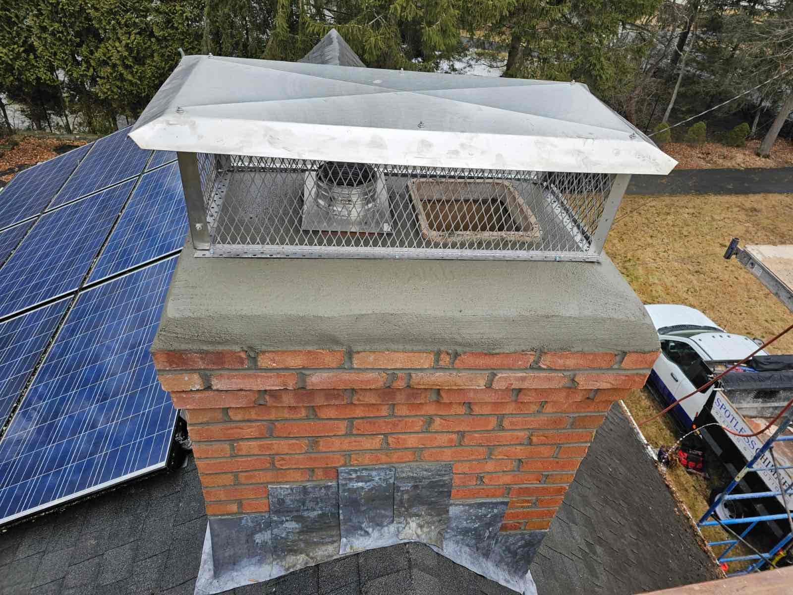 fairfield-ct-chimney-cap-detail Finished brick chimney and stainless-steel cap in Fairfield, Connecticut