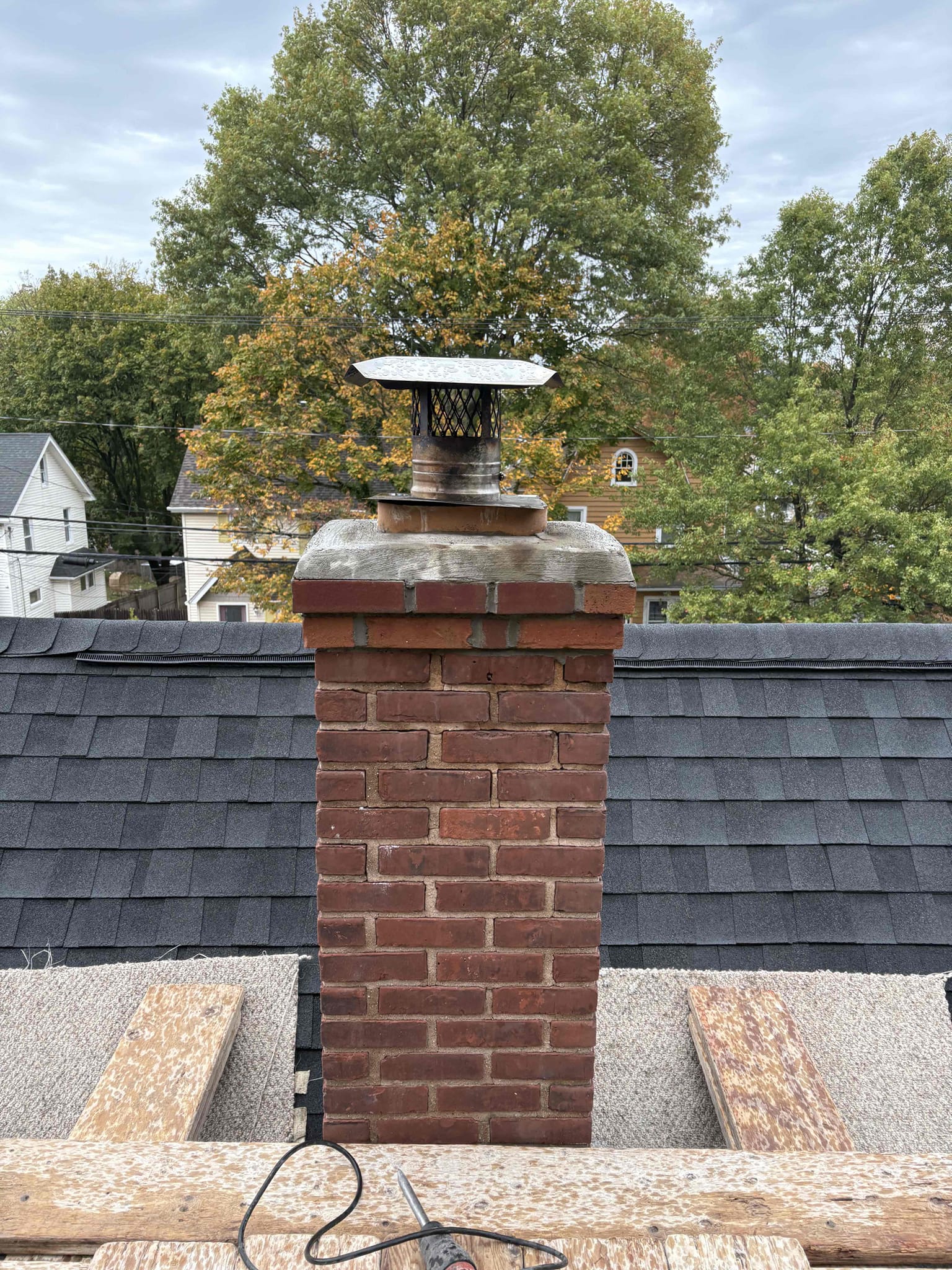 hamden-finished-partial-chimney-rebuild-close Close view of rebuilt brickwork, crown and cap on a Hamden, CT chimney