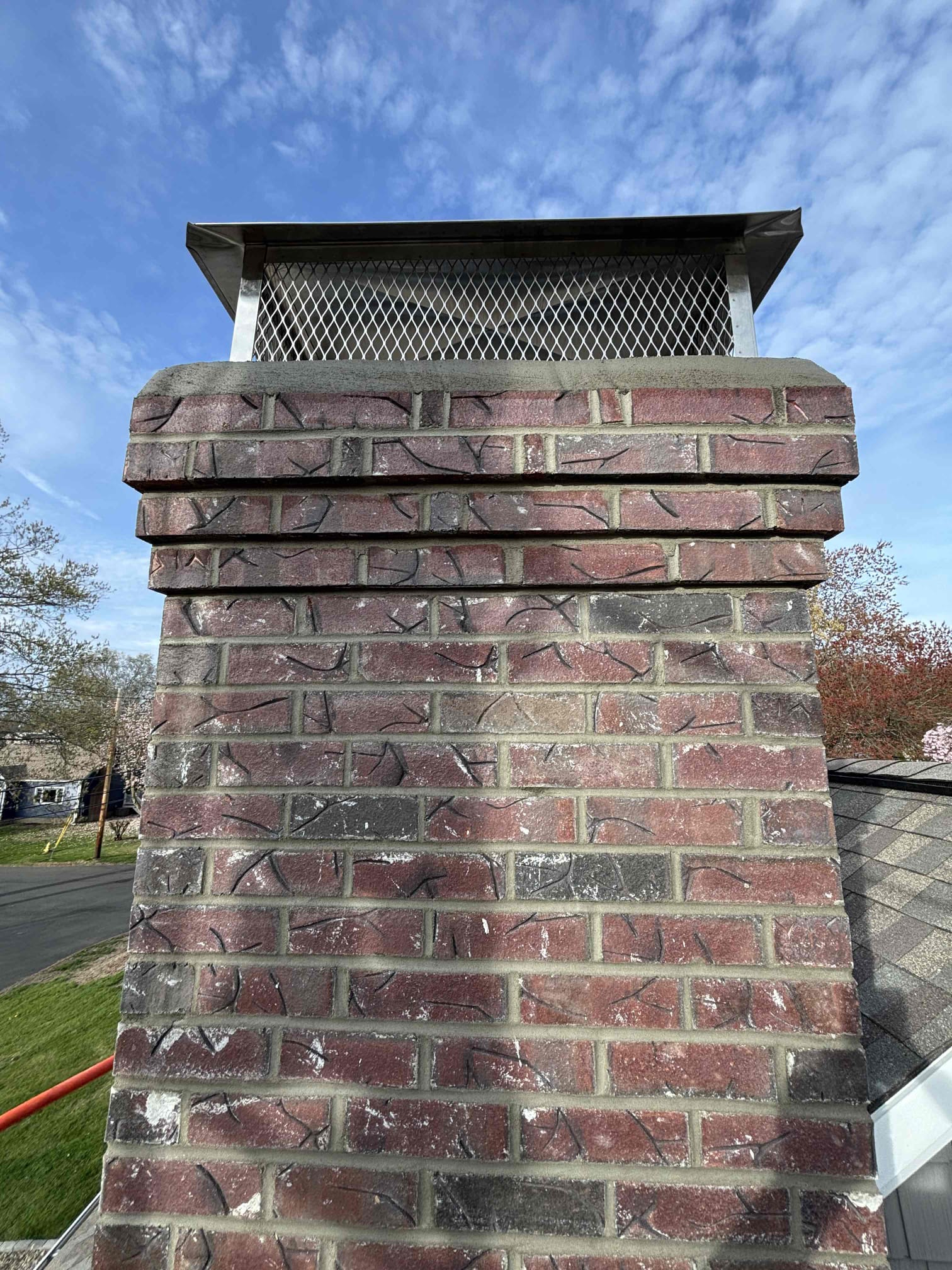 Close view of new brickwork and cap on a Milford, CT chimney rebuild