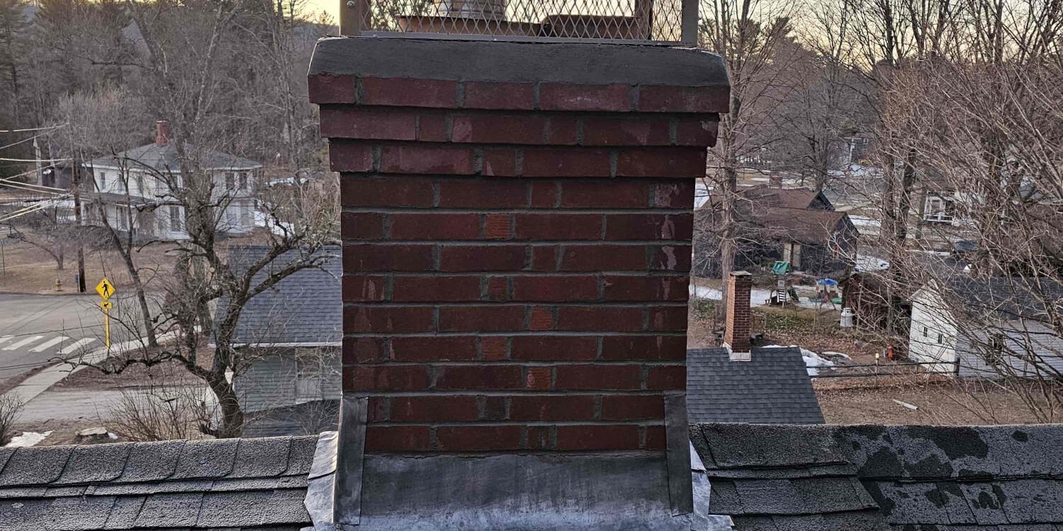 Finished brick chimney rebuild with stainless cap in North Canaan, Connecticut