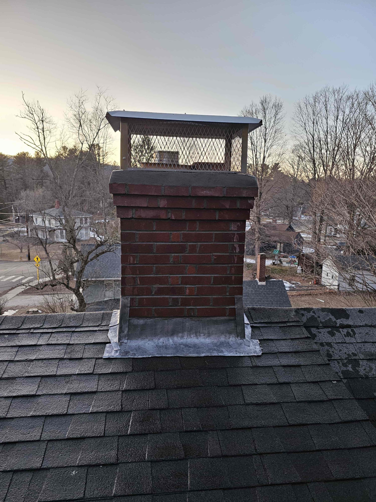 Finished brick chimney rebuild with stainless cap in North Canaan, Connecticut