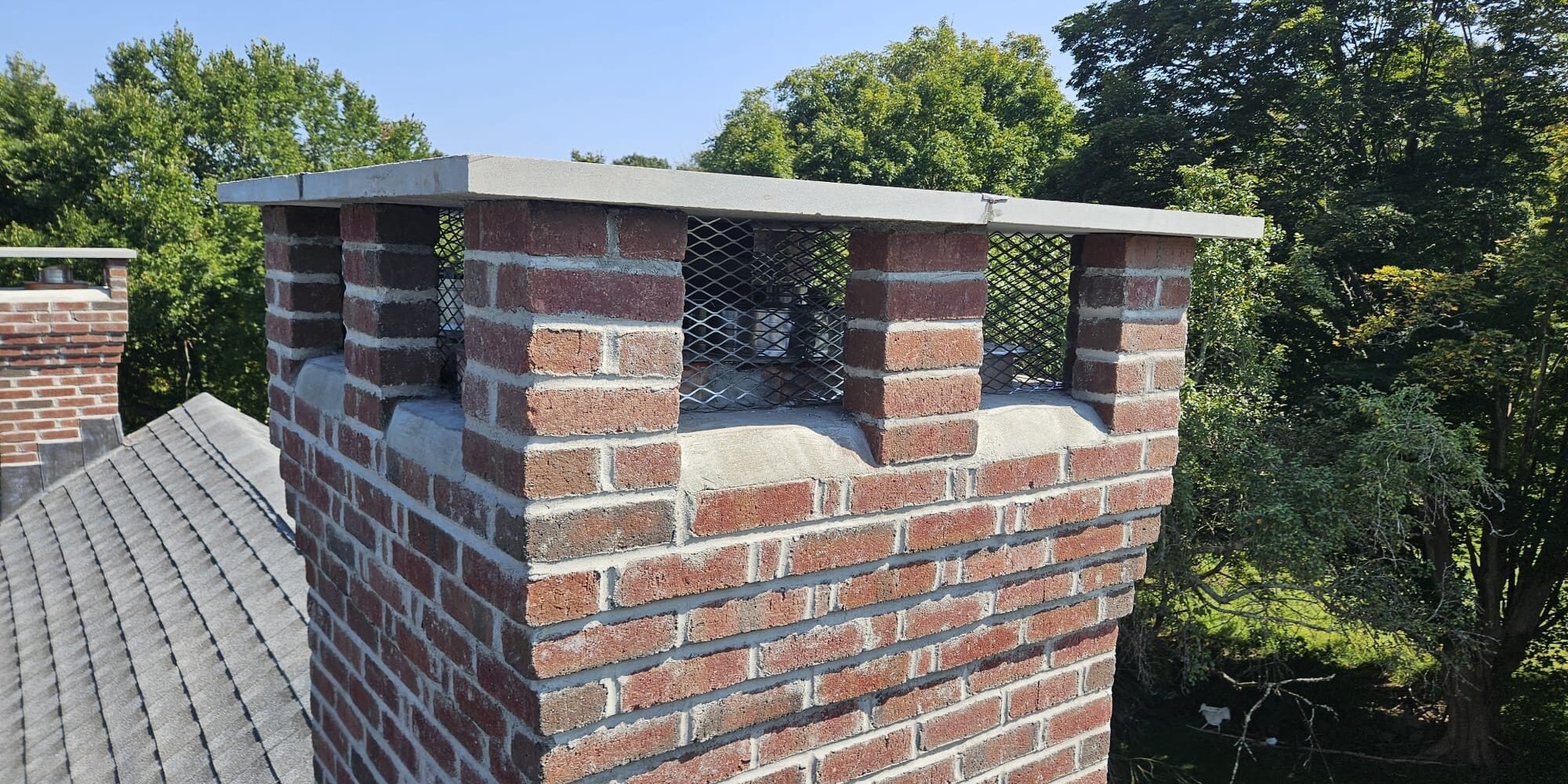 North Stonington, CT rebuilt multi-flue chimney Rebuilt multi-flue brick chimney in North Stonington, Connecticut