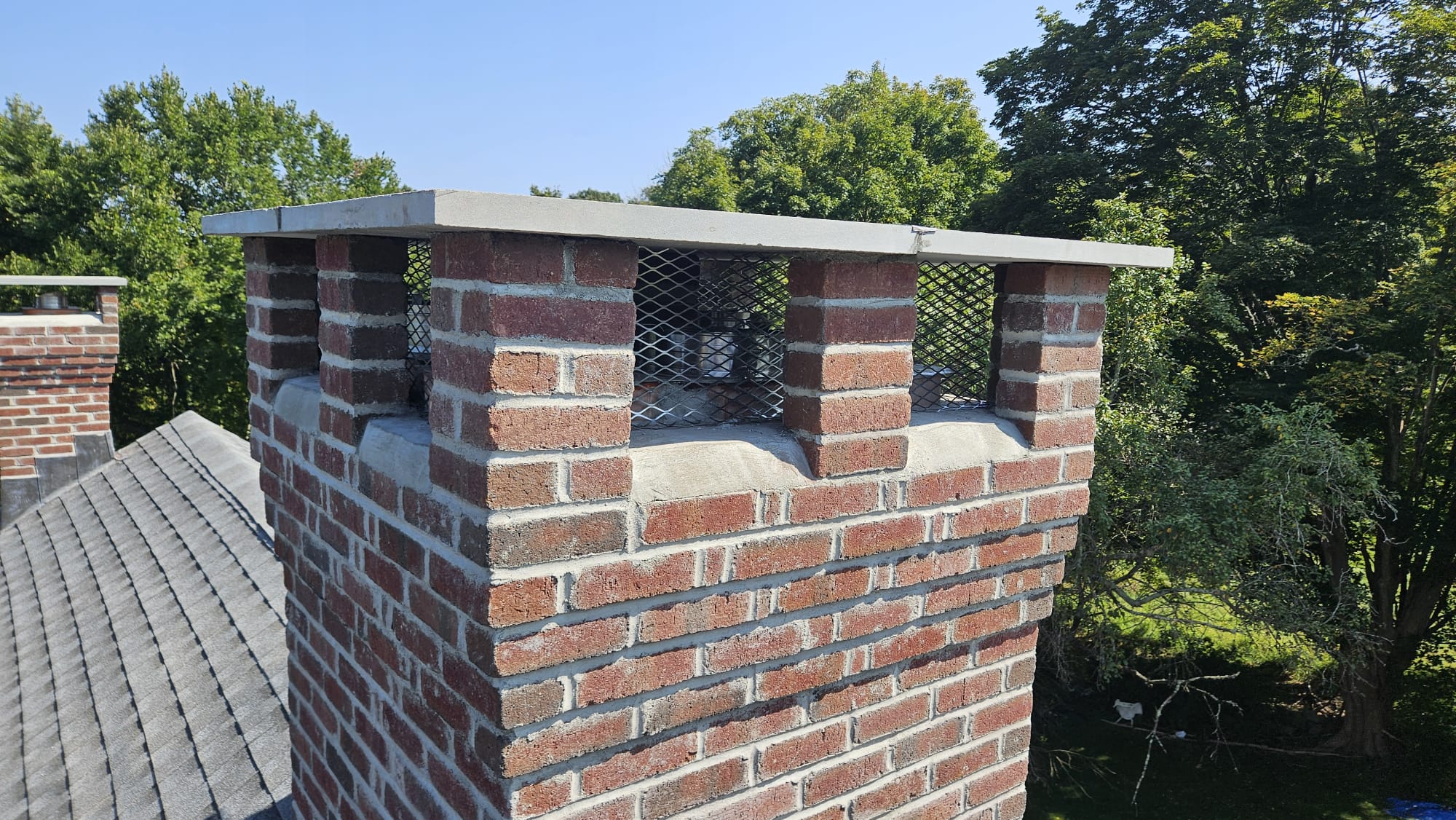 North Stonington, CT rebuilt multi-flue chimney Rebuilt multi-flue brick chimney in North Stonington, Connecticut