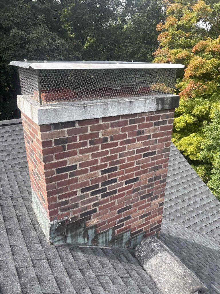 Southington chimney cap after installation Finished custom multi-flue chimney cap installation in Southington, CT