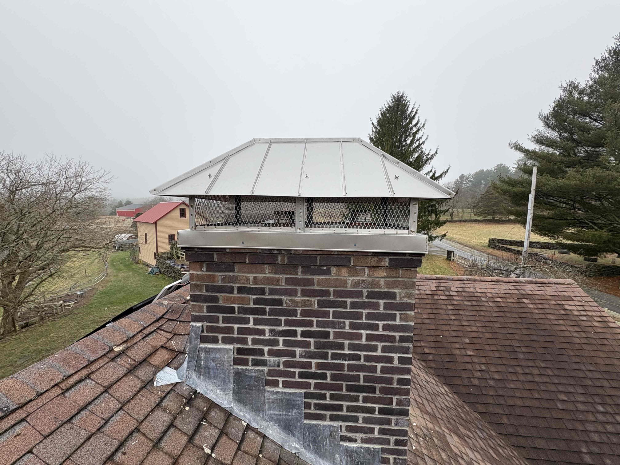 Custom outside-mount multi-flue chimney cap installed in Sterling, Connecticut
