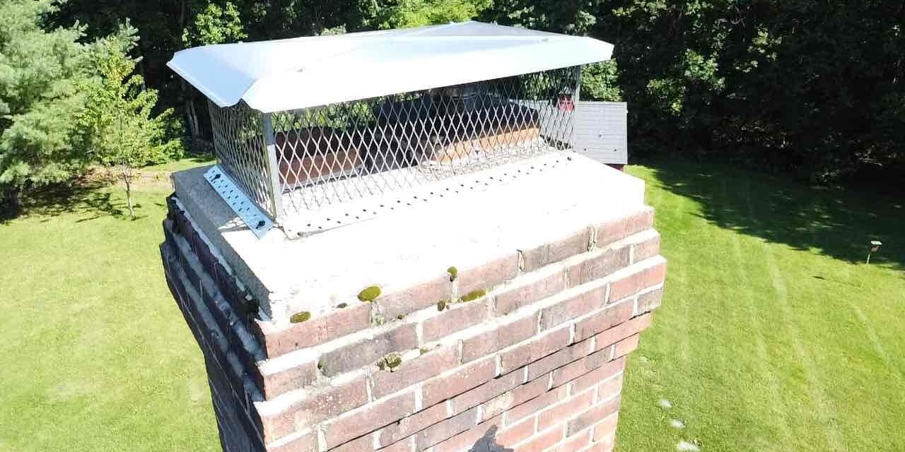 Union, CT chimney cap and crown inspection Chimney cap and crown inspected on a home in Union, Connecticut